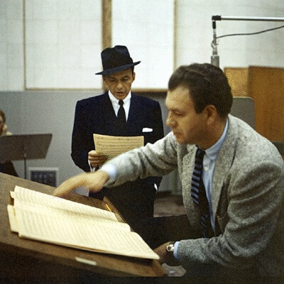 Nelson Riddle and Frank Sinatra rehearsing with big band